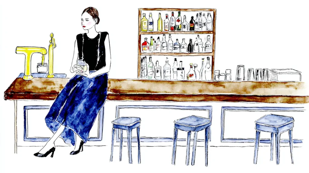 静かな夜のスナックでカウンターに座る女性のイメージ